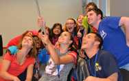 Kansas YLF delegates laugh and smile as they try to take a group selfie!